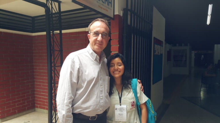 Author Robby Miller with young female Colombian medical student and interpreter.