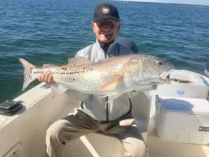 One of the guests on a boat with his big catch.