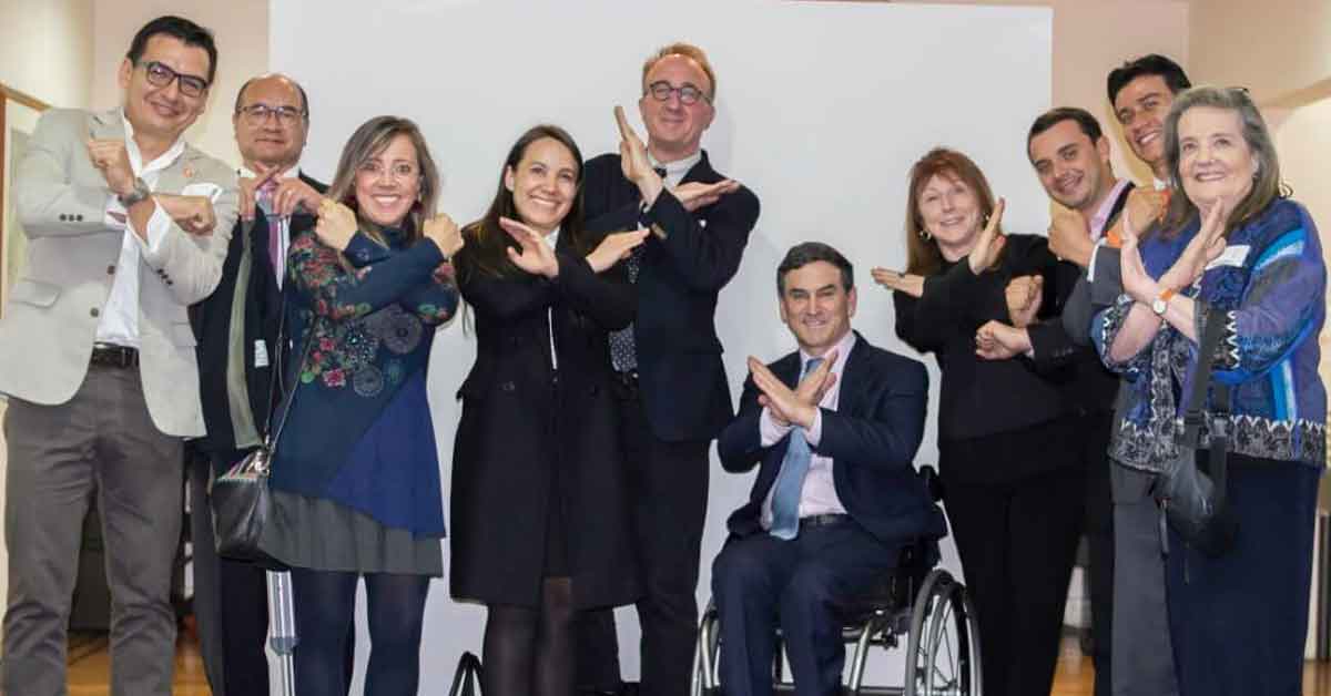 At the Colombian Presidential Compound in Bogota with Colombian Fragile X clinicians and researchers, parents, including leaders of the Asociación X Frágil Colombia, MIND Institute faculty and the Special Advisor on Disability Issues to the President of Colombia (seated).