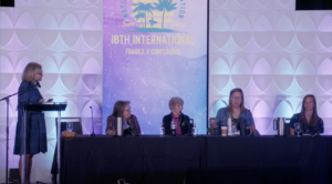 Four panelists seated at a table