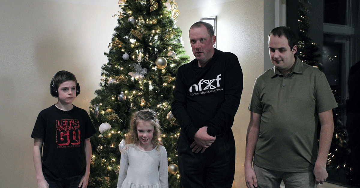 Brady, Nellie, Aaron, and Cody by the Christmas tree.