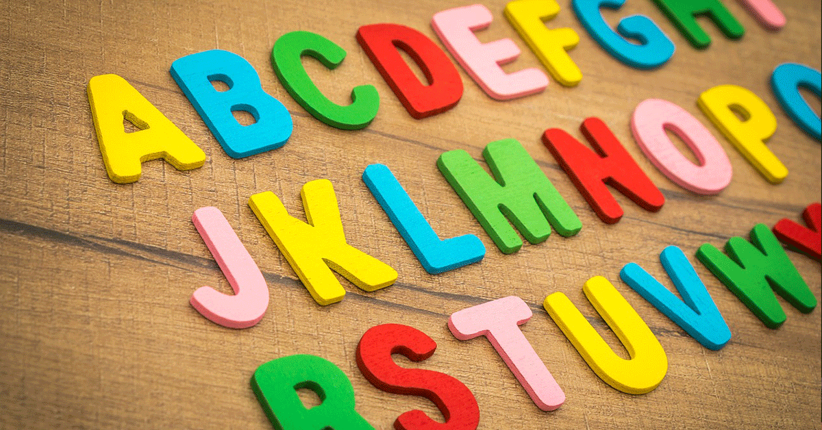 Alphabet letters laid out on a table.