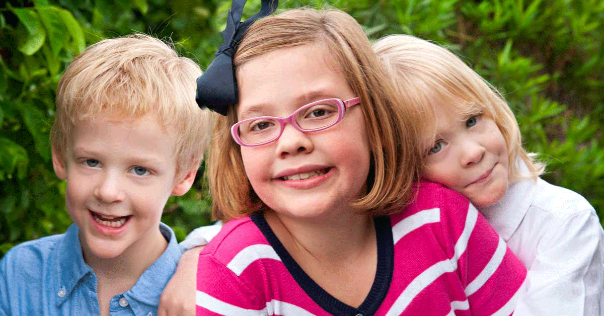 Three happy siblings.