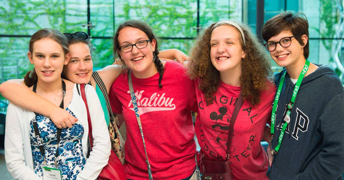 Three young women enjoying the NFXF International Fragile X Conference.