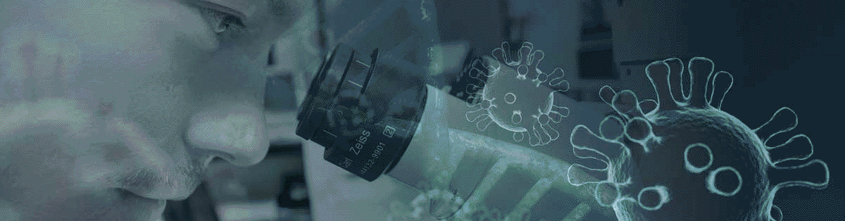 Researcher viewing through a microscope.