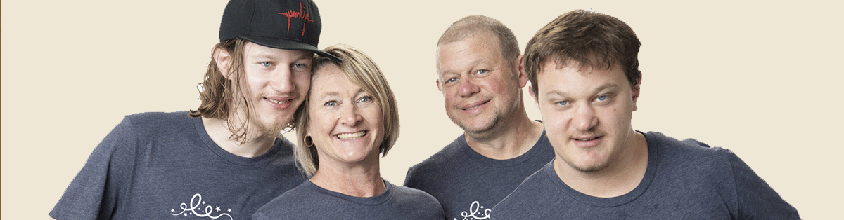 a family of four, parents and two young adult sons.