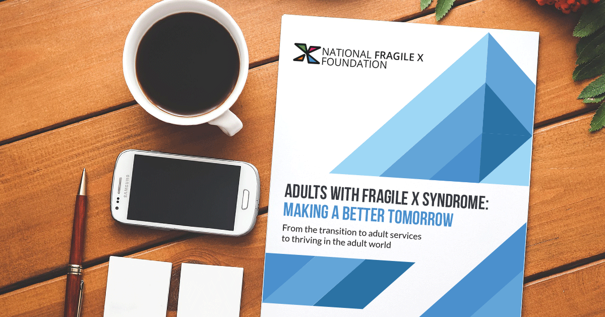 Adults With Fragile X Syndrome e-book on a table with a smartphone and cup of coffee