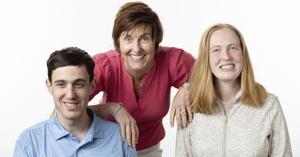 A mother with her two adult children.