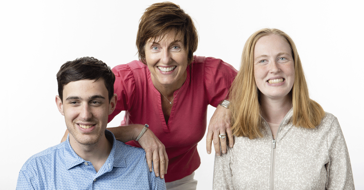 A mother with her two adult children.