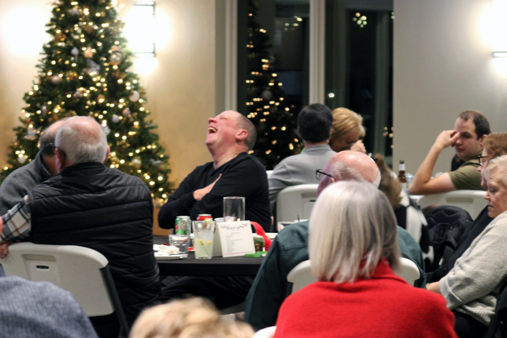 A guest is laughing.