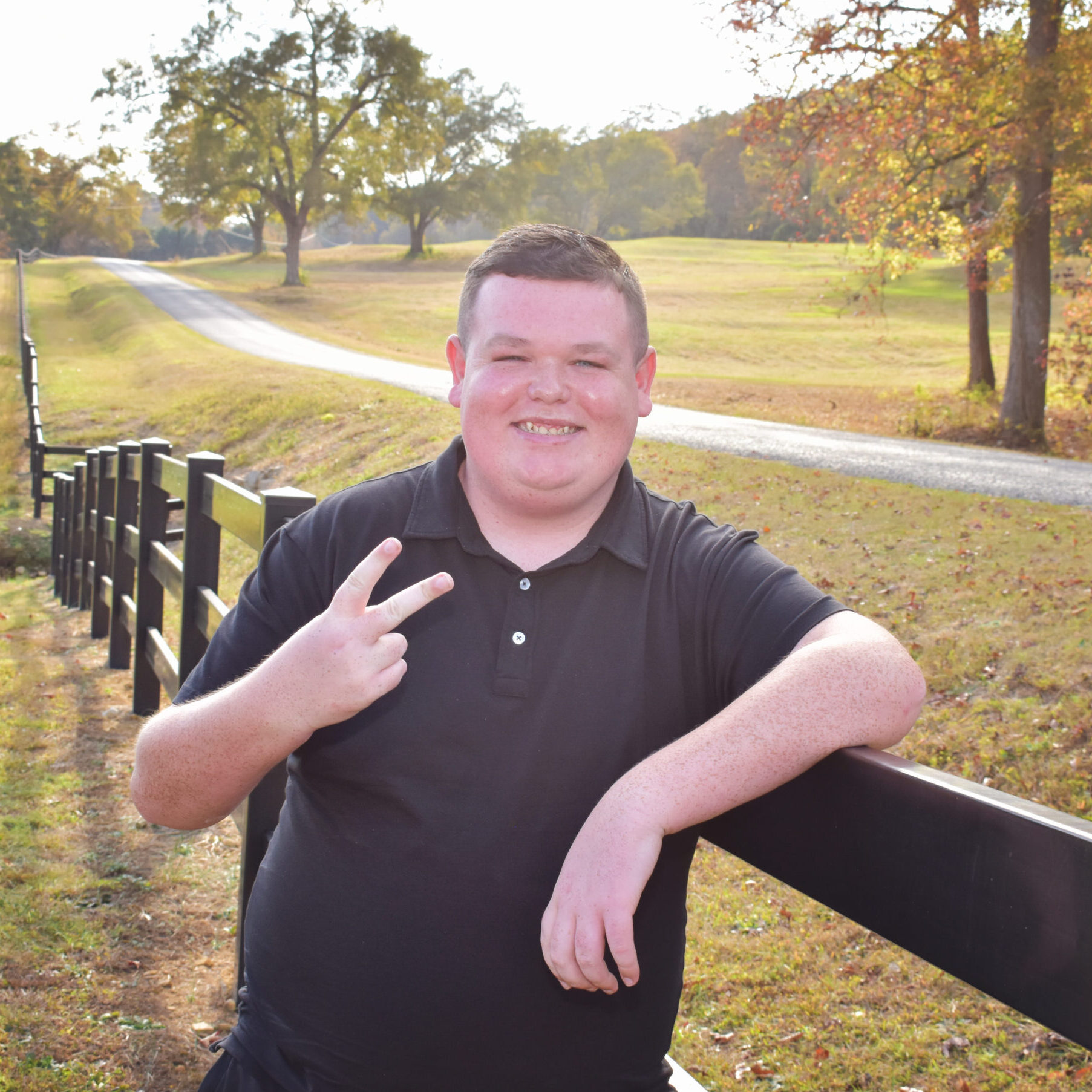 Jakob Mitchell giving the peace sign