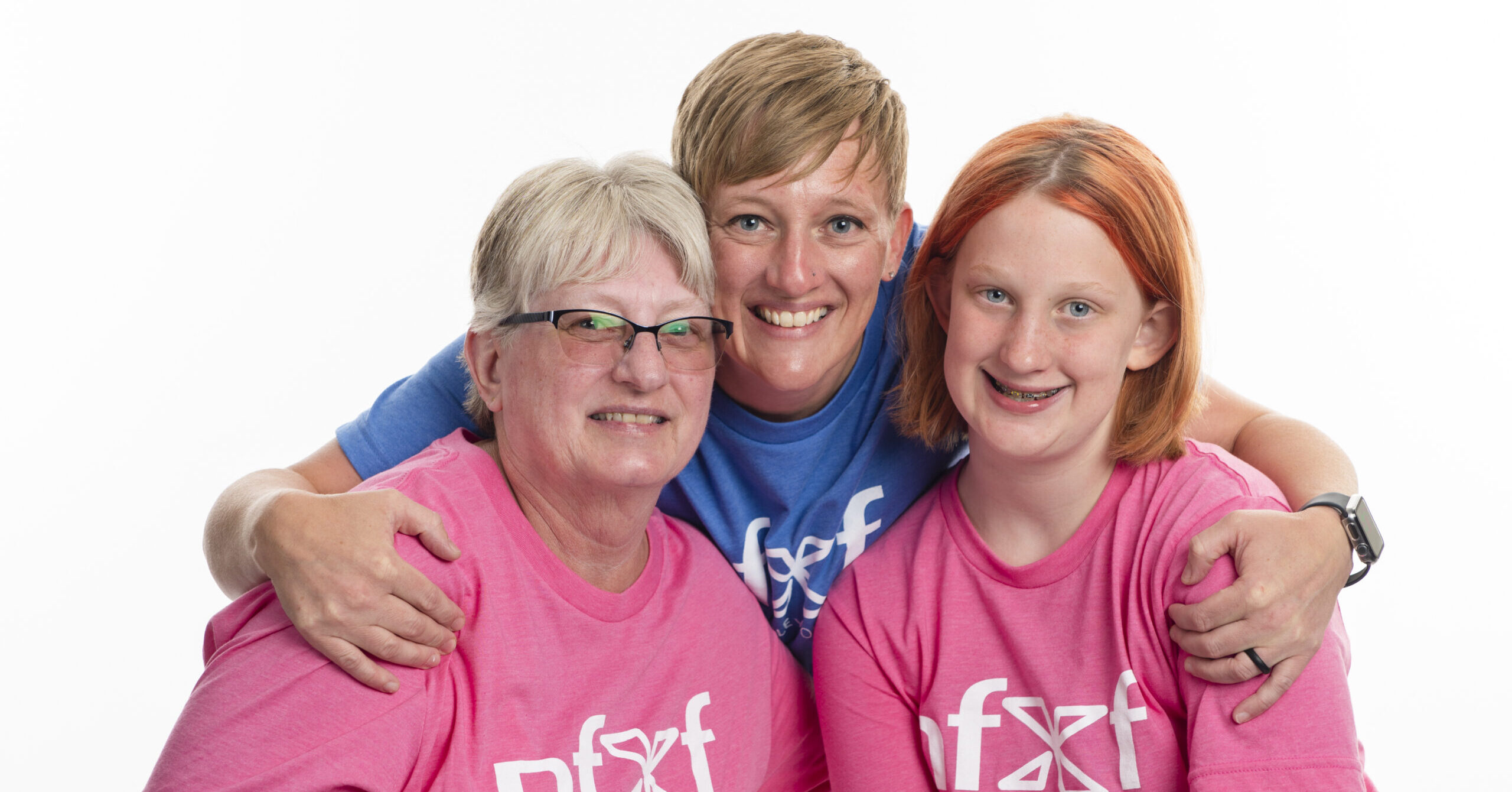 girl, mom, and grandmother, wearing NFXF t-shirts