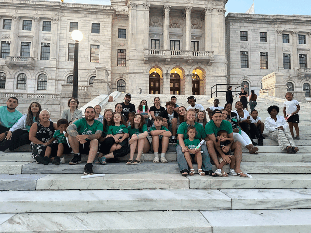 More Little Rhody Warriors on the steps of the Rhode Island State House for Fragile X Awareness Day, wearing matching X-Strides tees!