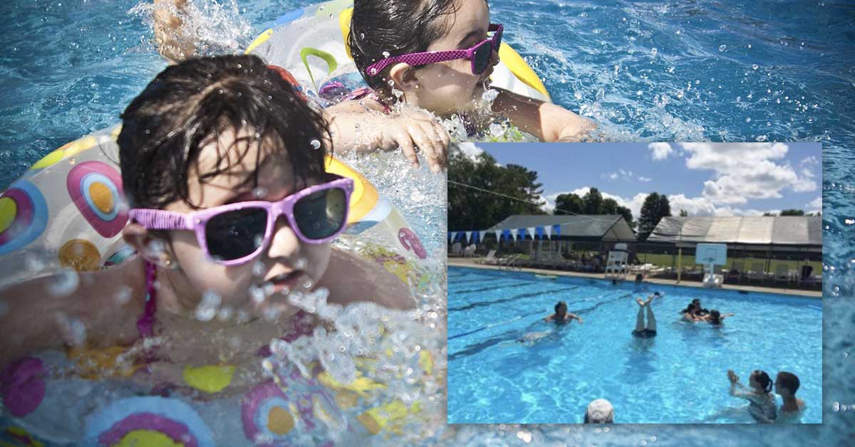 jcc-swimming-event-featured Kids swimming in a swimming pool.