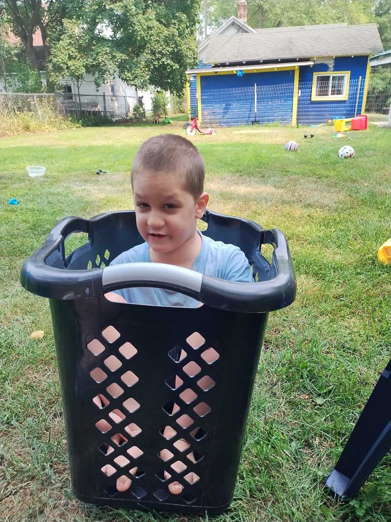 Daryl Graves outdoors in a laundry basket