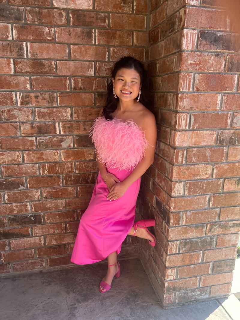 Carlyn Cothran in a beautiful pink formal dress.