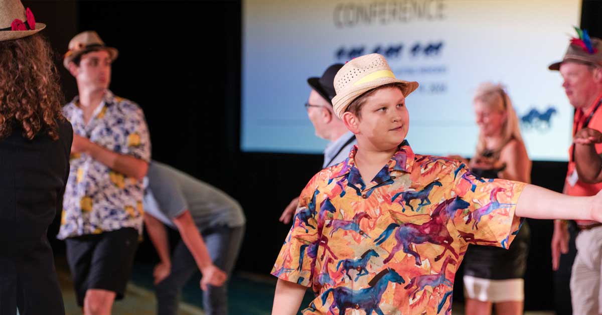 Young boy dancing at the Fragile X conference