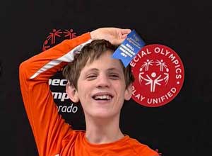 Christopher with his Special Olympics ribbon