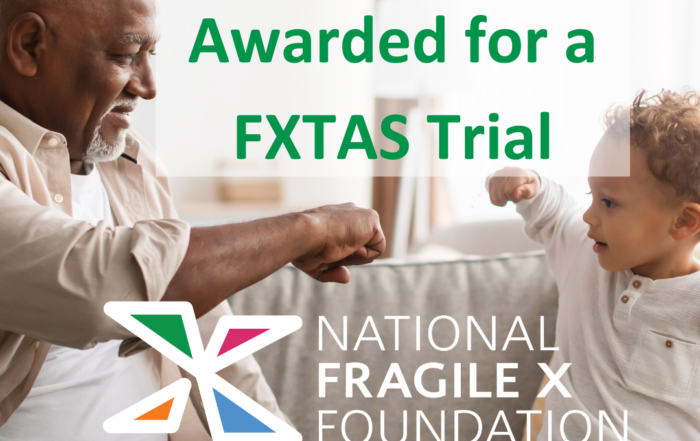 Older man fist bumping little boy with text "DOD Grant Awarded for a FXTAS Trial"
