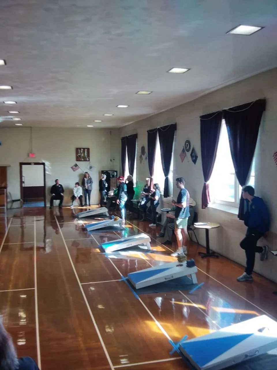 Adults playing corn hole