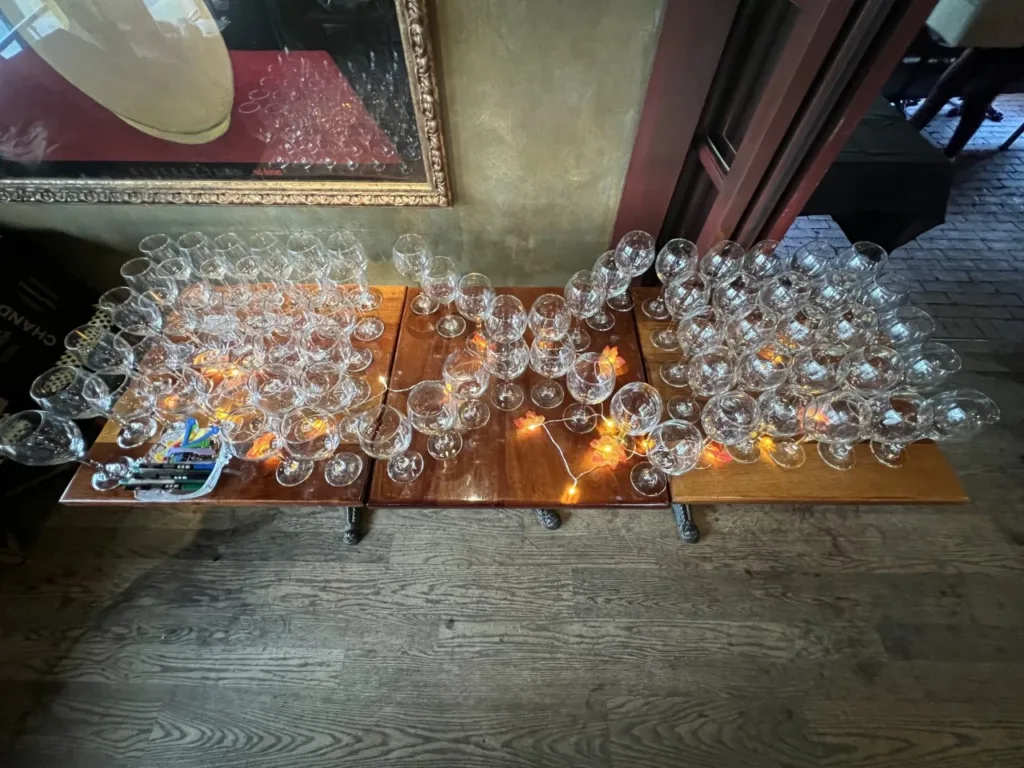 Wine glasses set up in an X formation to celebrate all Fragile X syndrome families.