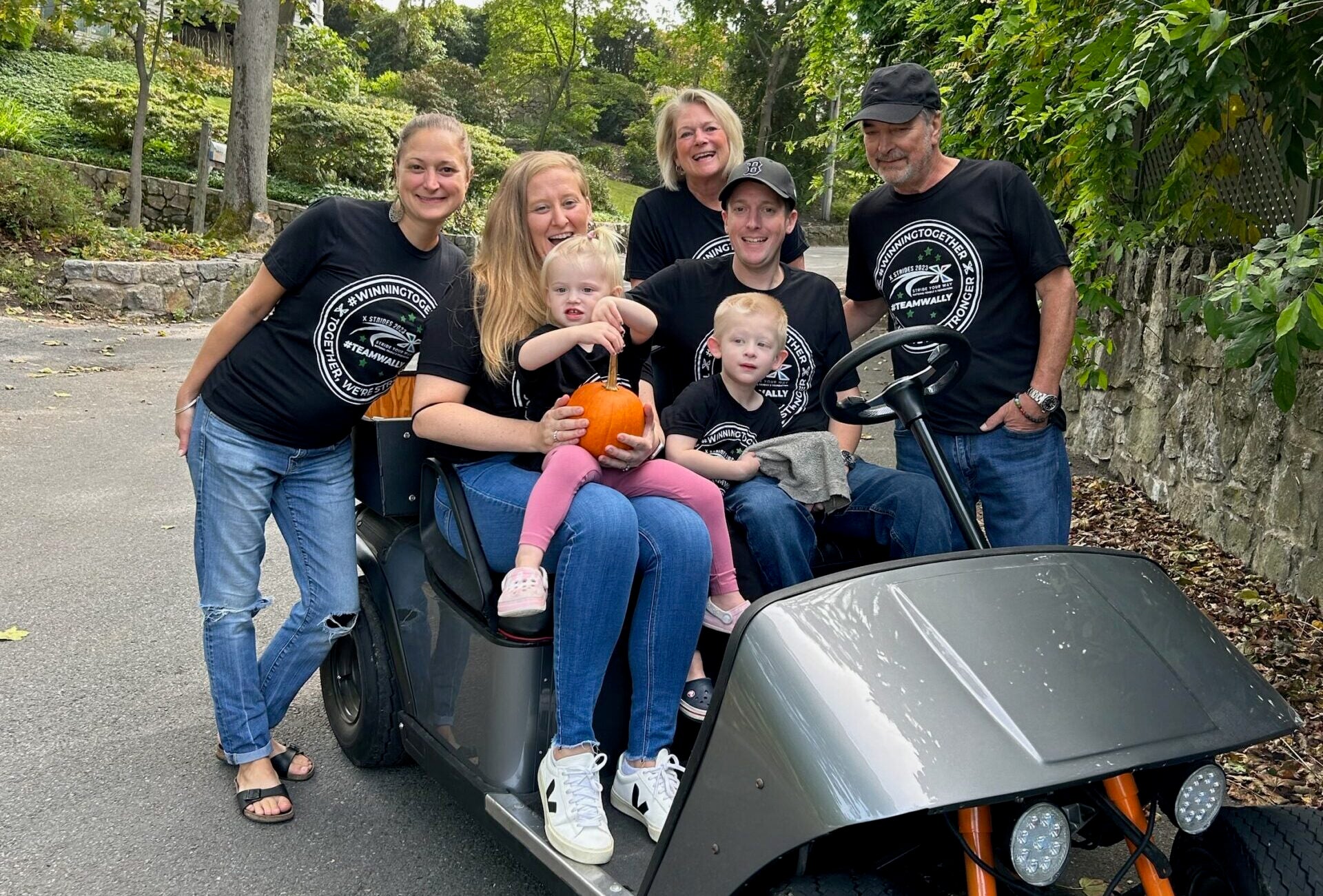 Wally and his family wearing their #teamwally X strides t-shirts