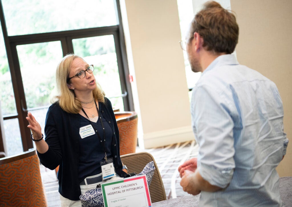 A medical professional speaking to a parent