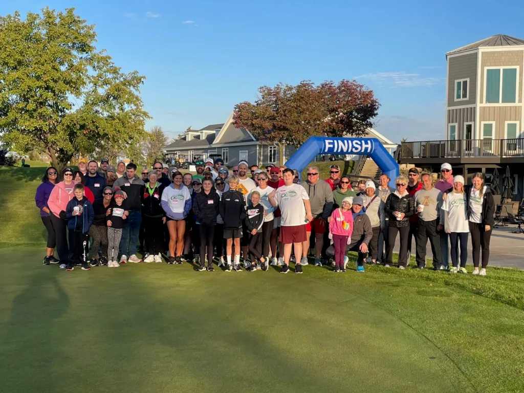 2022 Heartland X Strides participants at the event finish line on a beautiful clear day.