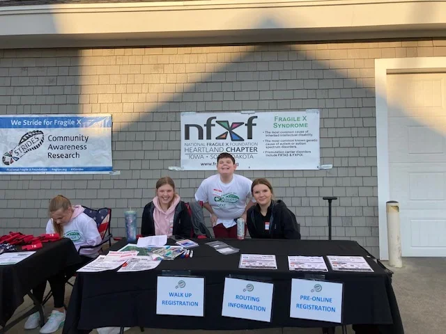 Registration table at the Heartland X Strides event and fundraiser for Fragile X syndrome.