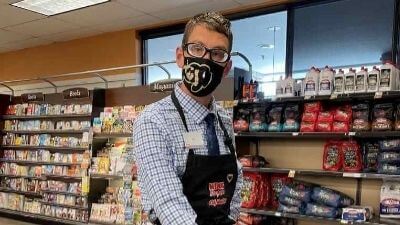 Ian wearing a mask while working at King Sooper grocery store