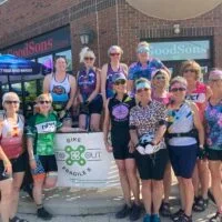 Nancy Carlson and other riders in the Heartland chapter Bike To X Out Fragile X fundraising event outside of Exile Brewing Co. in Des Moines, Iowa.