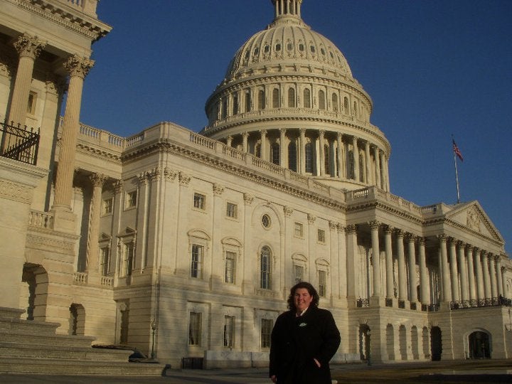 Woman standing in front of the US Capitol