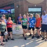 Nancy Carlson and other riders in the Heartland chapter Bike To X Out Fragile X fundraising event outside of GoodSons market in Des Moines, Iowa.