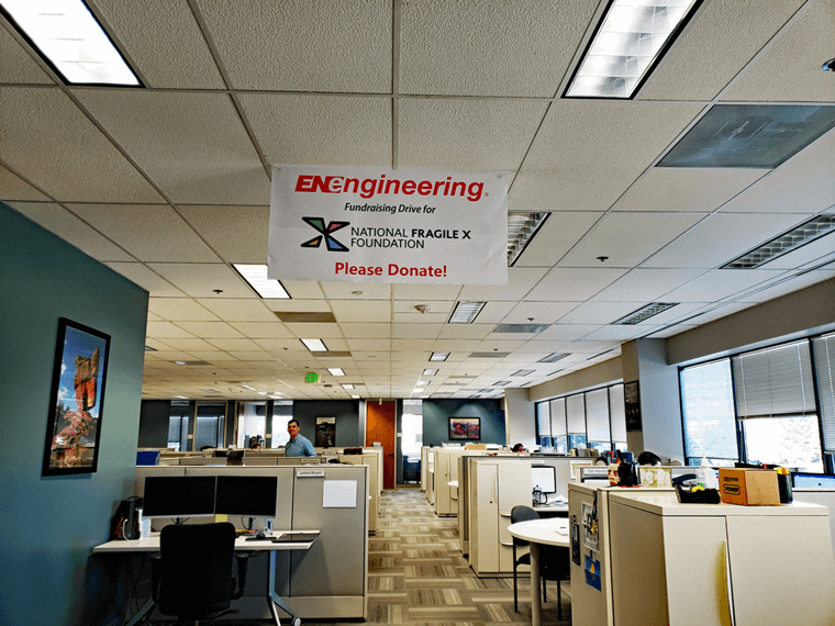 NFXF Fundraiser sign hanging from ceiling in EN Engineering office