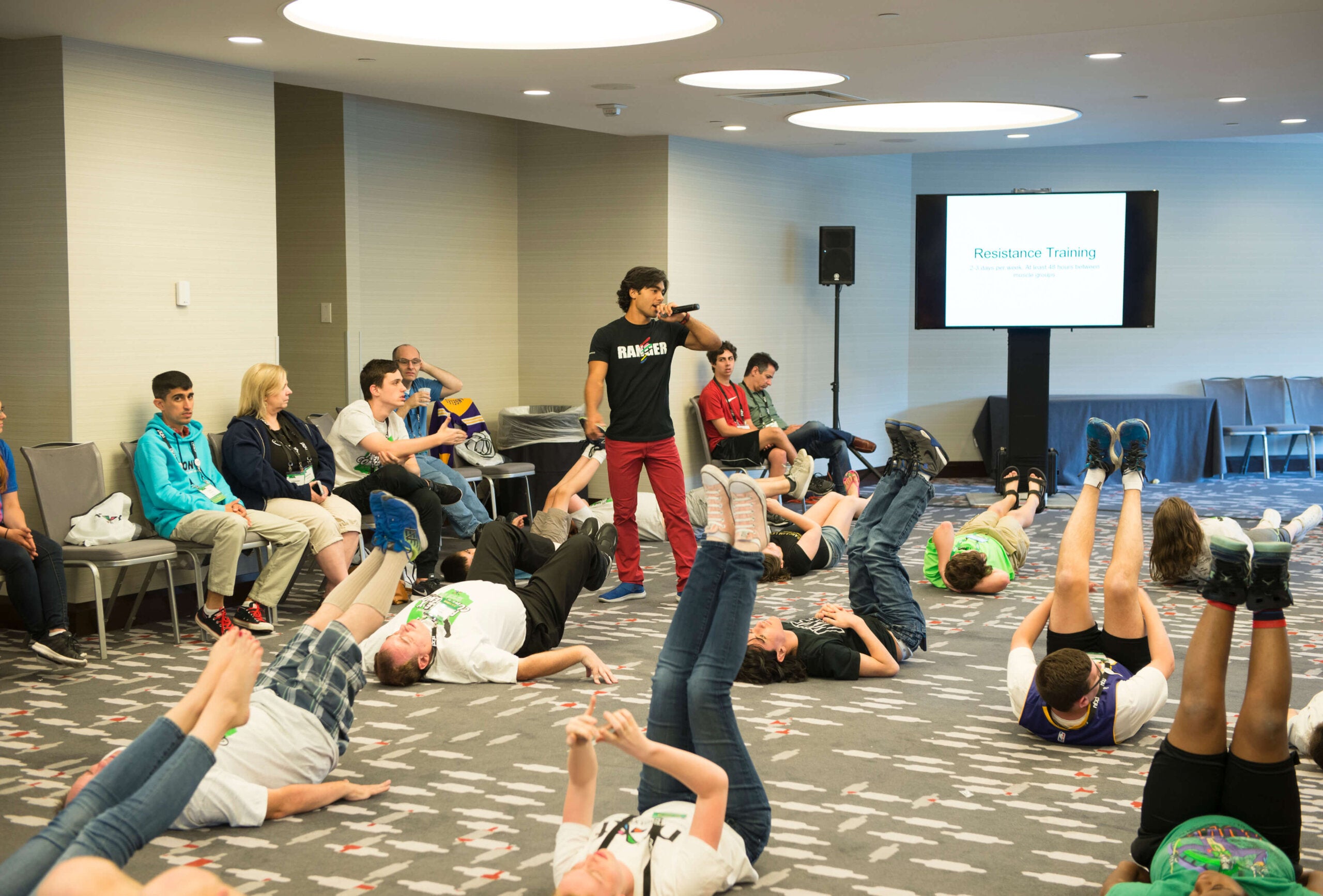 Brennan Mejia teaches an exercise session at the NFXF Conference