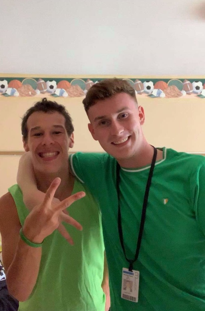 Brian and his friend wearing green