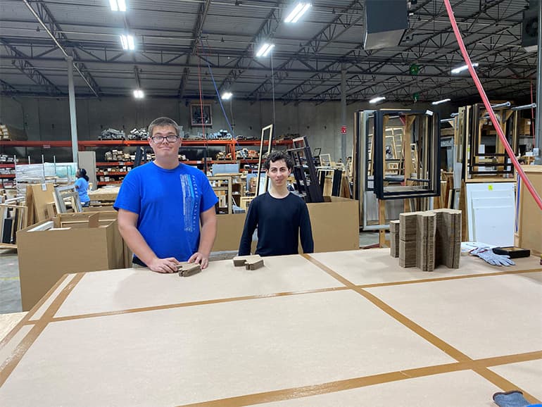 Corey Gershenson and Eric at work table