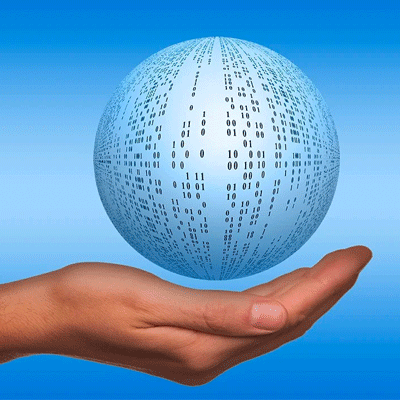 A globe covered in data being held in a hand.