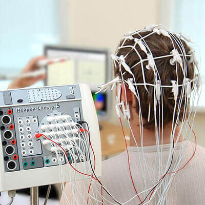 Male patient attached to eeg machine