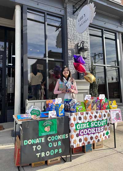 Evemarie selling Girl Scout Cookies