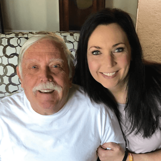 Father with FXTAS and his daughter, smiling.