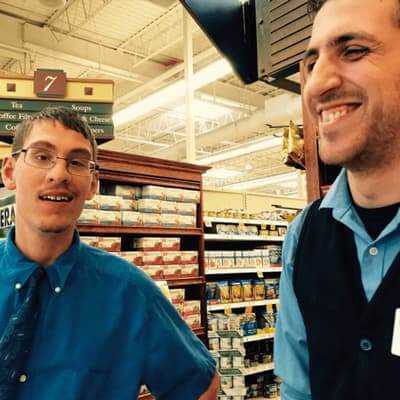Ian and co-worker in grocery store