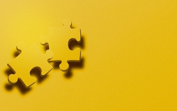Gold puzzle pieces indicating ASD
