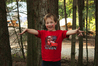 Happy boy in the woods