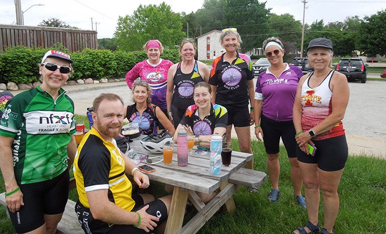 "Bike To X Out Fragile X" riders taking a mid-ride break.