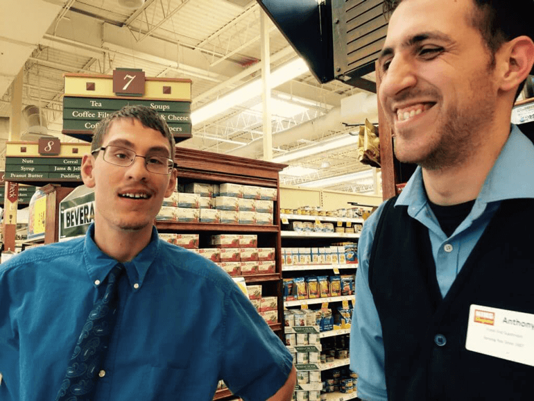 Bagger Ian and manager Anthony inside King Sooper grocery store