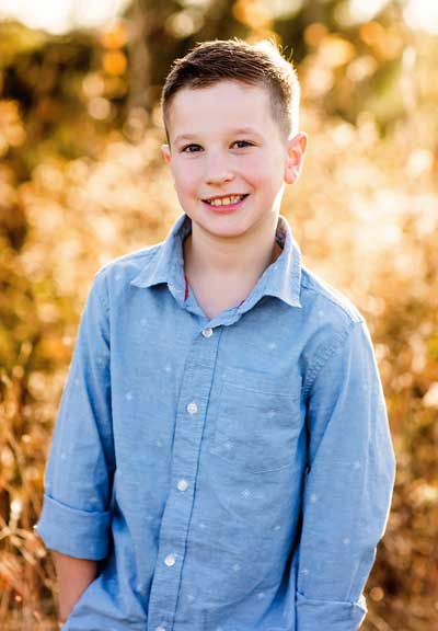 Young boy in a field.