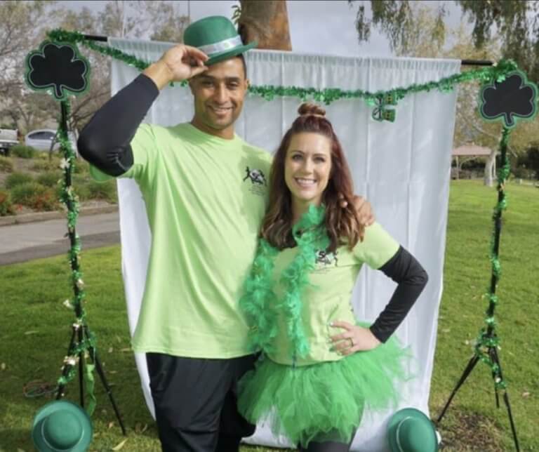 Jen Newsome and a friend dressed all in green for St. Patrick's Day.