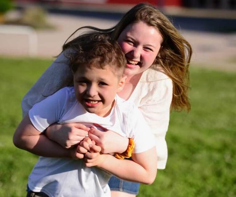 Olivia Butler playing with her brother Liam in the park.