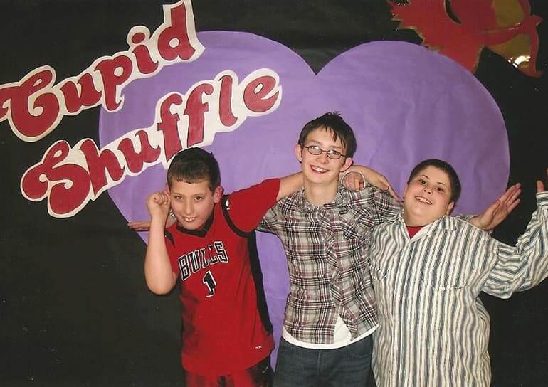 Parker and two friends at a school dance